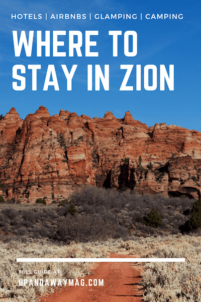 Pin for Zion National Park Lodging  Guide with a red dirt trail leading towards scenic red rock formations.