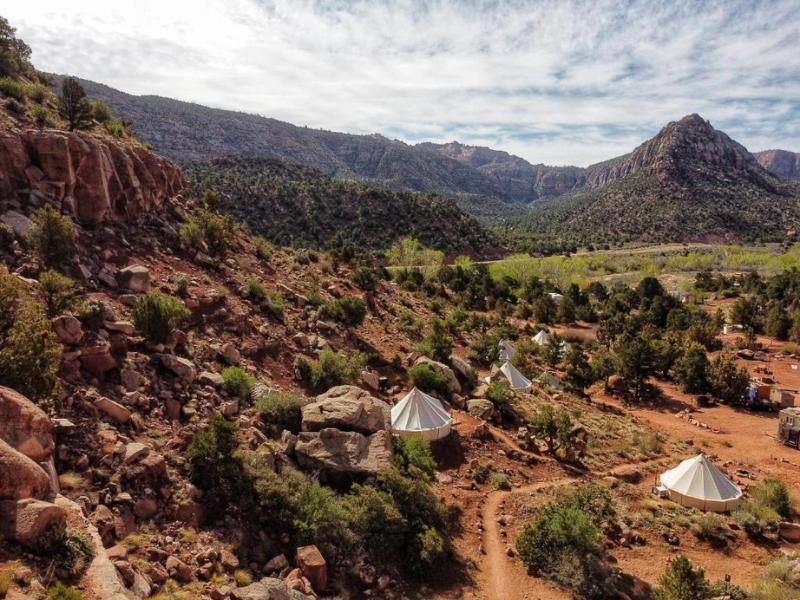 View over Zion Glamping Adventures near Zion National Park with multiple canvas tents visible on a hillside