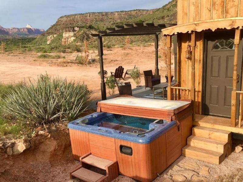 Private hot tub at one of the tiny houses at Zions Tiny Oasis, a glamping property near Zion National Park