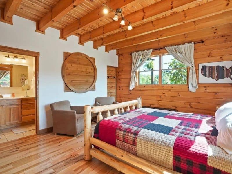 Bedroom with quilted bed in luxury Hocking Hills cabin