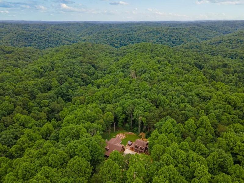 Aerial view of large luxury Hocking Hills cabin located on 85 acres of woodland
