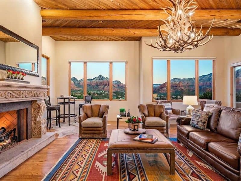 Living area with red rock views from windows at Sedona Luxury Airbnb