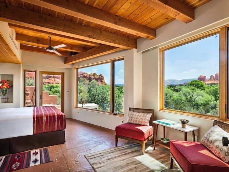 Bedroom with large windows and red rock views at Sun Cliff Luxury Sedona Airbnb