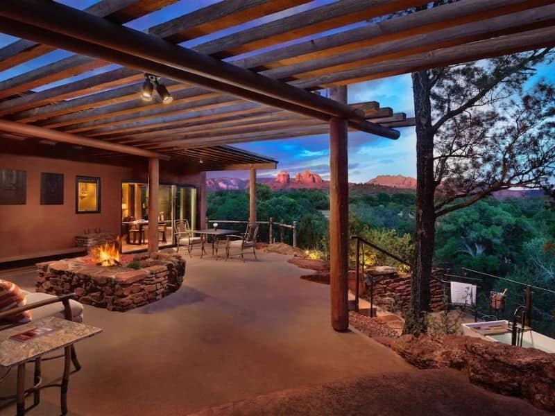 Outdoor living area with firepit and red rock views at Sun Cliff Luxury Sedona Airbnb