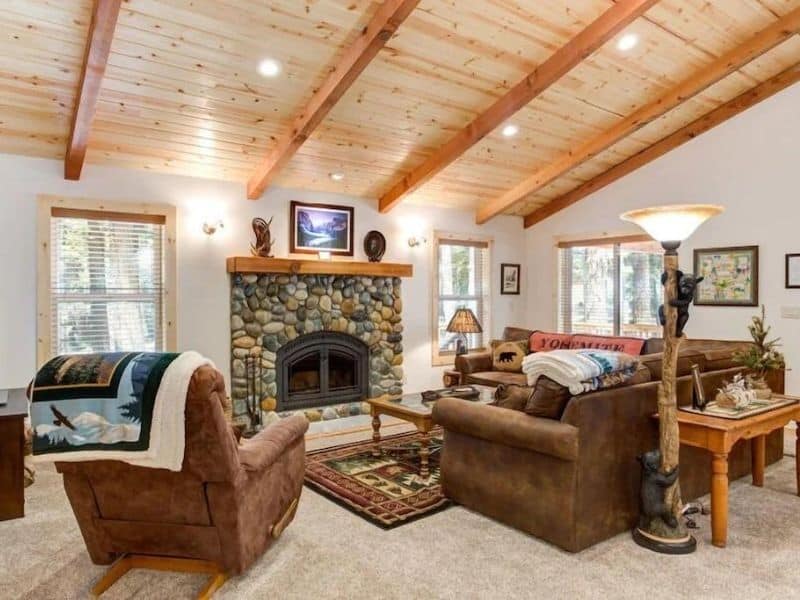 Interior living area with fireplace of Yosemite cabin rental