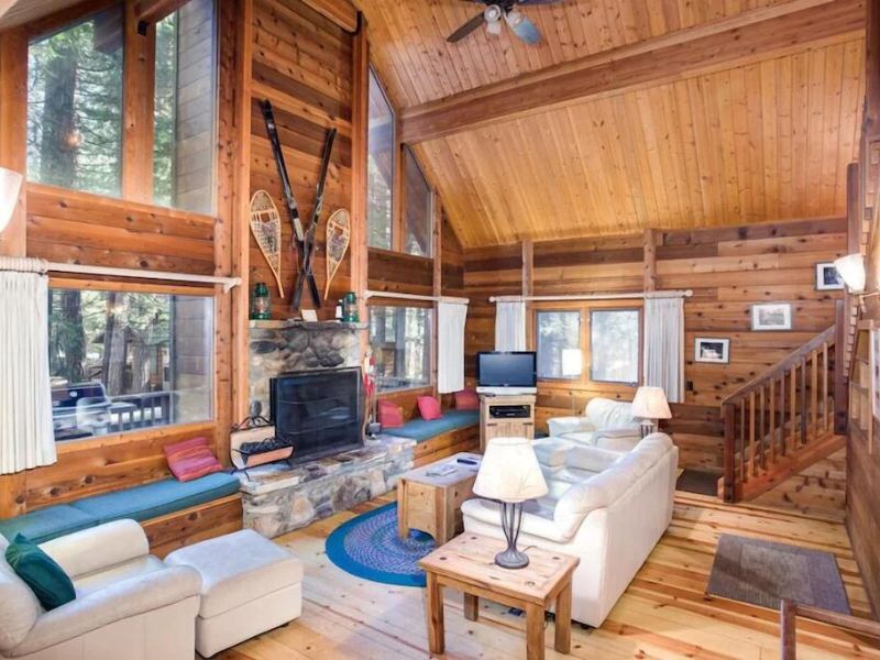 Living room with fireplace at Yosemite cabin rental in Wawona