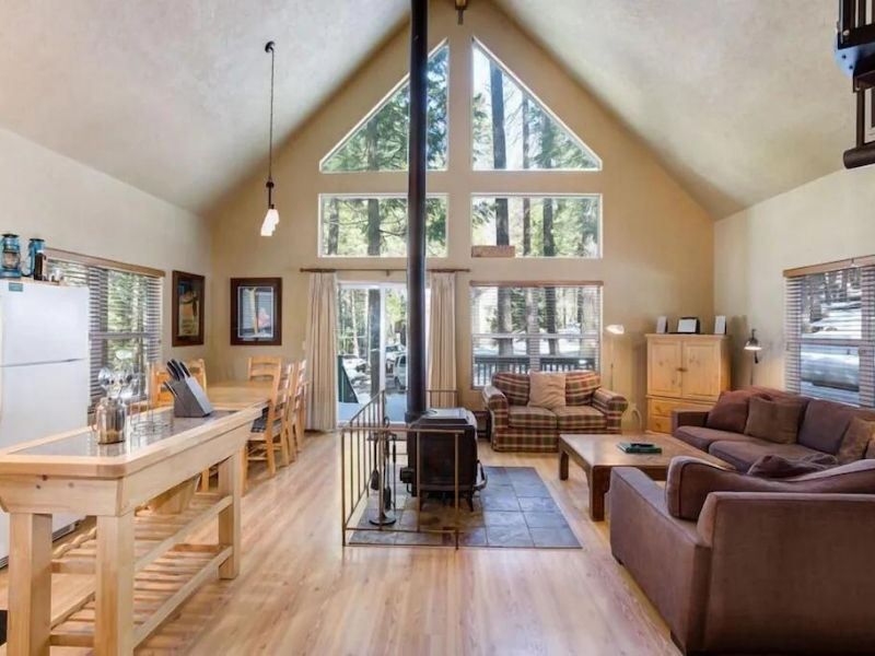 Living area and fireplace of Yosemite cabin rental in Wawona