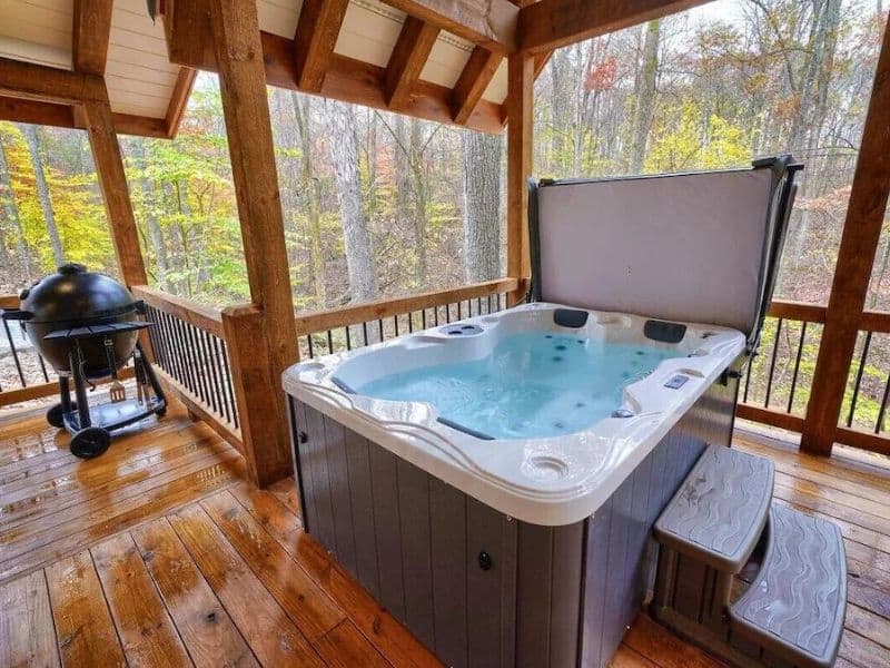 Covered hot tub at cabin for rent in Hocking Hills, OH
