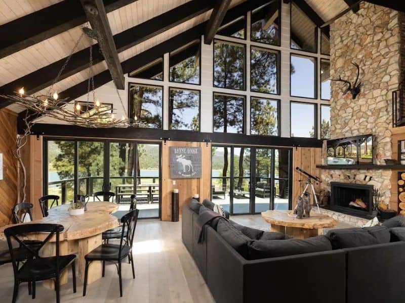Luxury cabins in Big Bear - living area with fireplace and large windows overlooking the lake