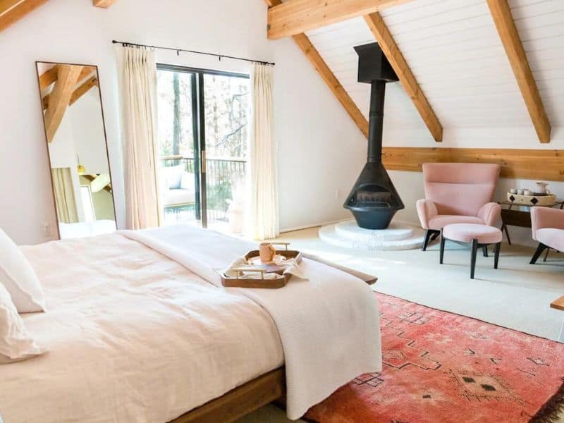 Luxury bedroom at Big Bear vacation home with fireplace