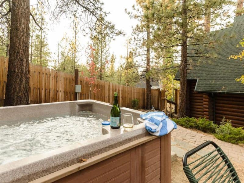Outdoor hot tub at Big Bear cabin vacation rental