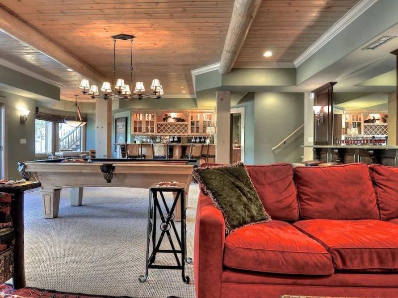 Pool table and kitchen at Big Bear Lake vrbo