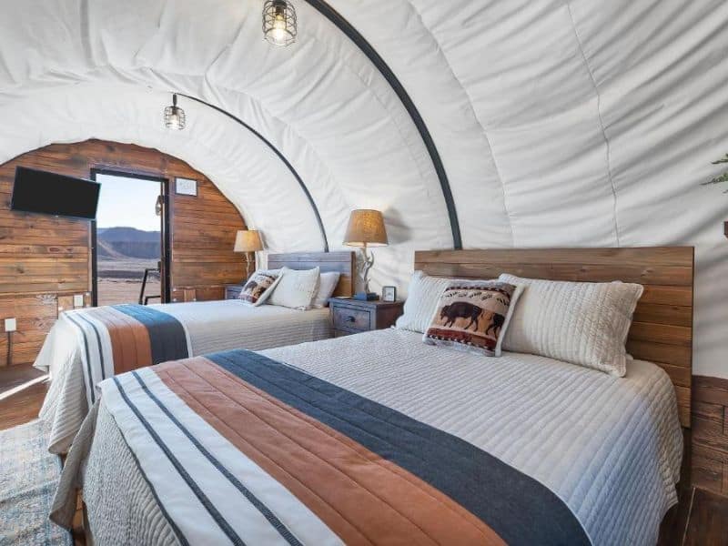 Interior of covered wagon glamping at Zion White Bison Glamping