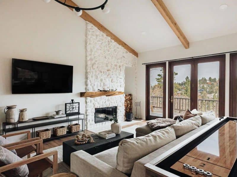 Living area with white fireplace in upscale cabin rental in Big Bear