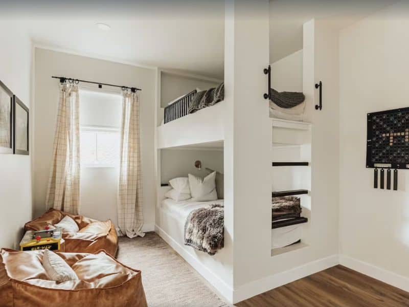 Bunk beds and bean bag chairs in kids room at luxury holiday cabin in Big Bear CA