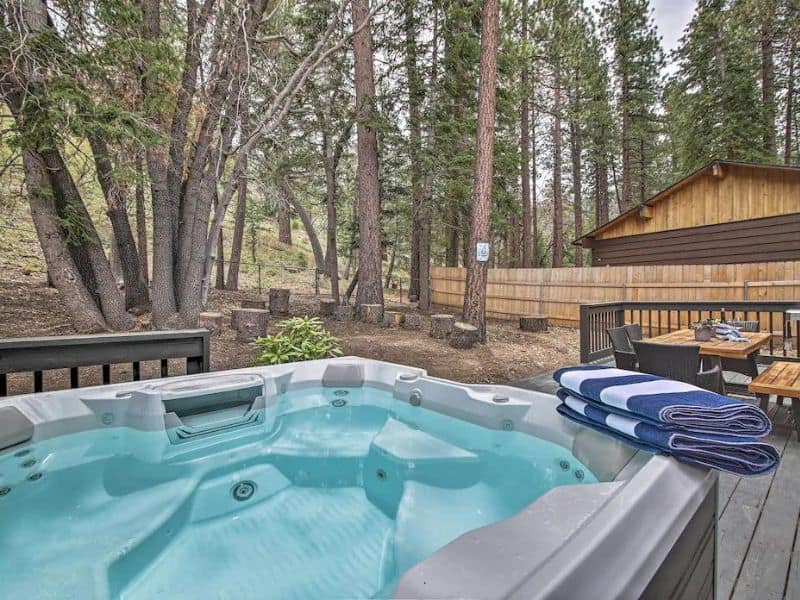Hot tub on outside deck in the forest at Big Bear vrbo near Bear Mountain