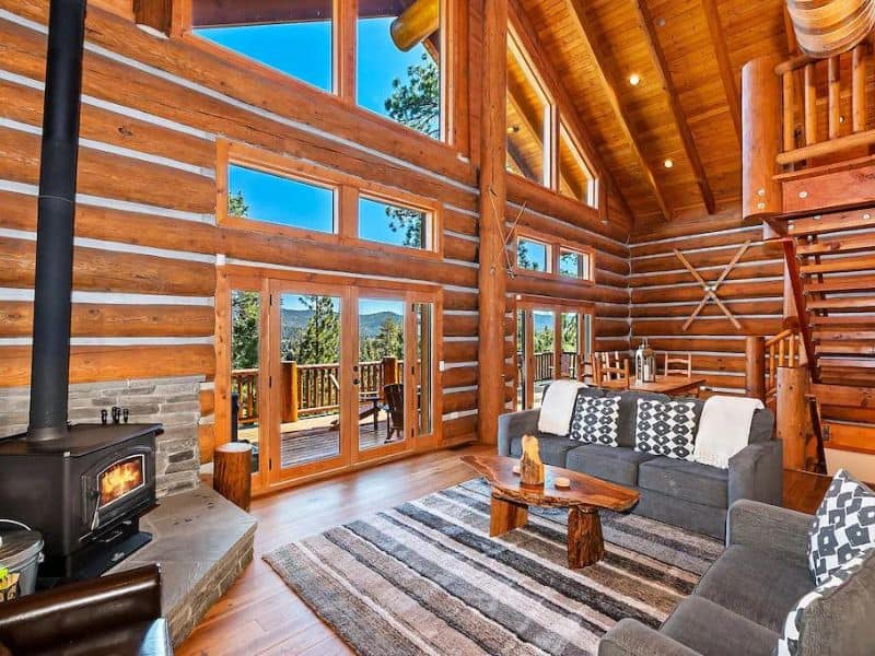 Luxury log cabin in Big Bear for rent with high vaulted ceilings and wood burning fireplace