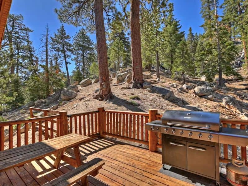Outdoor deck with gas grill at luxury cabin rental in Big Bear, CA