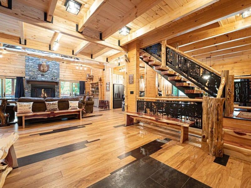 Rustic modern living area with fireplace and wood finishes in Hocking Hills vrbo