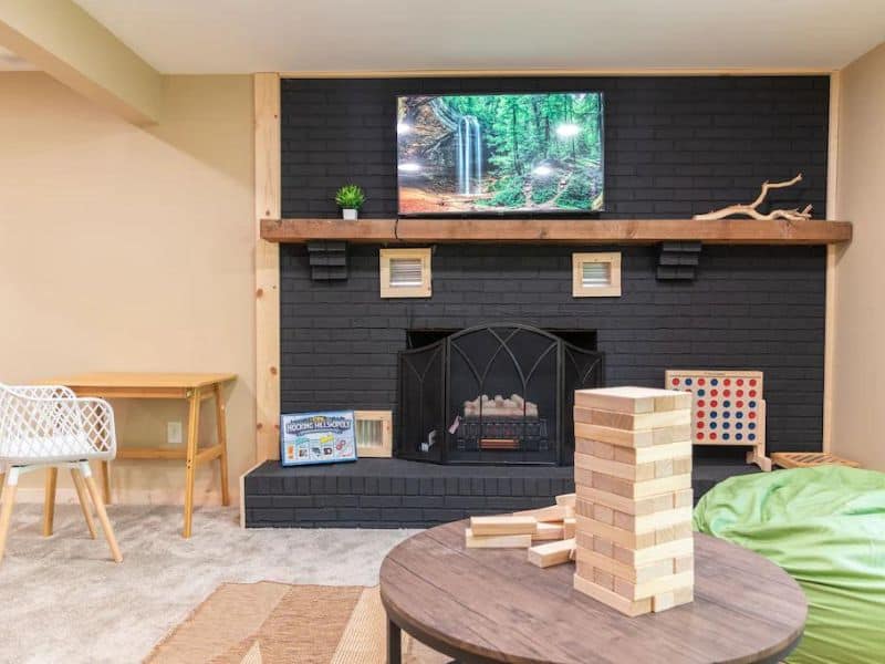 Fireplace with TV in game nook with jenga
