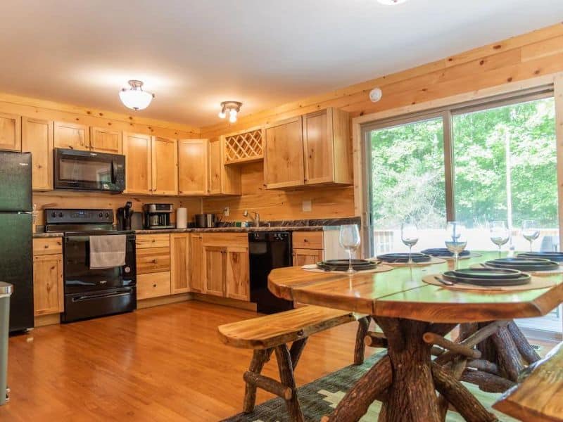 Rustic wood kitchen in large Hocking Hills cabin rental