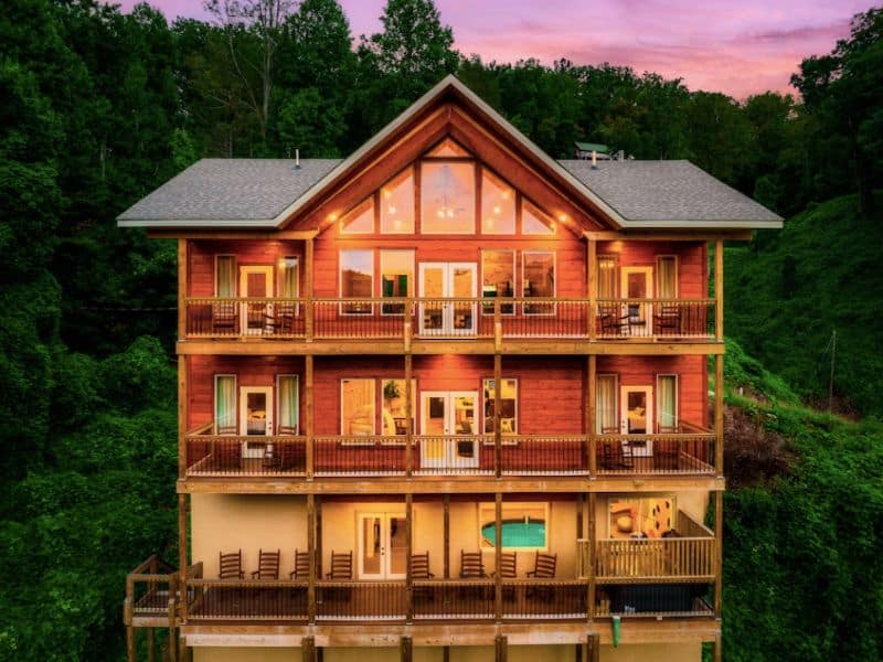 Exterior of large multi-story wood cabin rental in Gatlinburg that allows pets