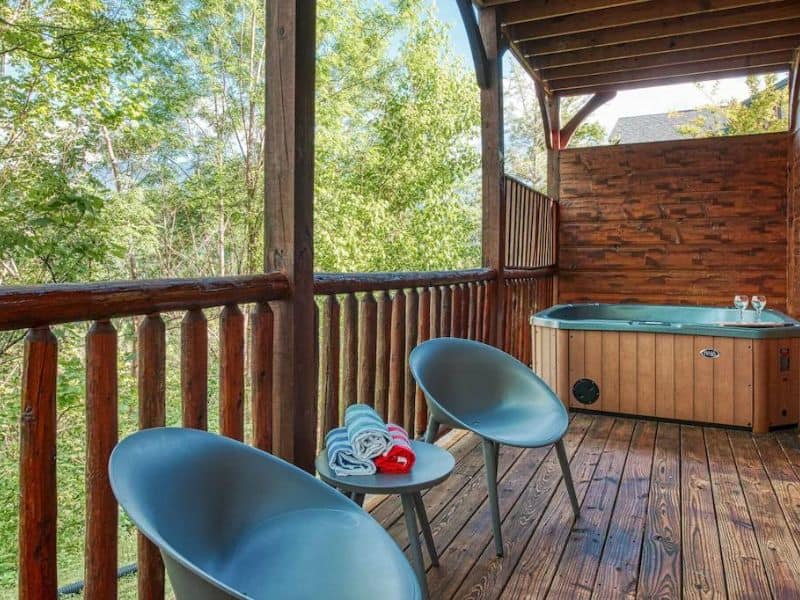 Covered deck with seating and hot tub