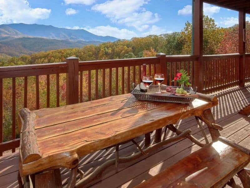 Wooden picnic table on deck overlooking the Great Smoky Mountains