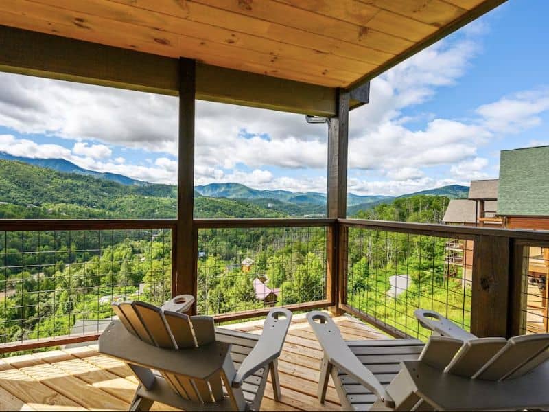 Covered deck with Adirondack chairs overlooking the Great Smoky Mountains