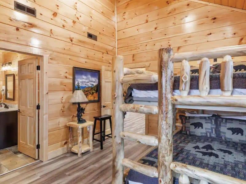 Rustic wooden bunk beds in a Gatlinburg cabin rental - part of a guide to the best large cabins in Gatlinburg
