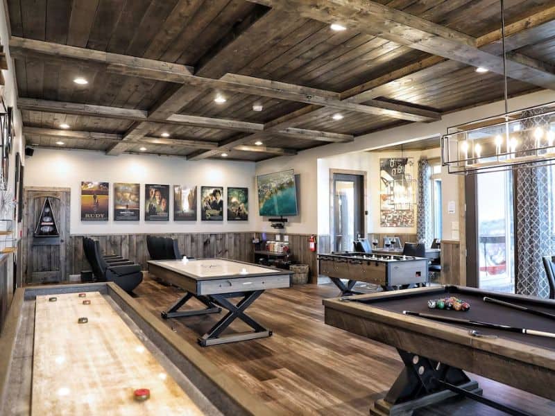 Game room at Gatlinburg vacation rental with pool table, shuffleboard, air hockey, and foodball