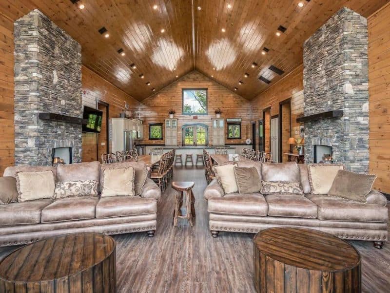 Large living area in Gatlinburg cabin with high ceilings and rustic furnishings.