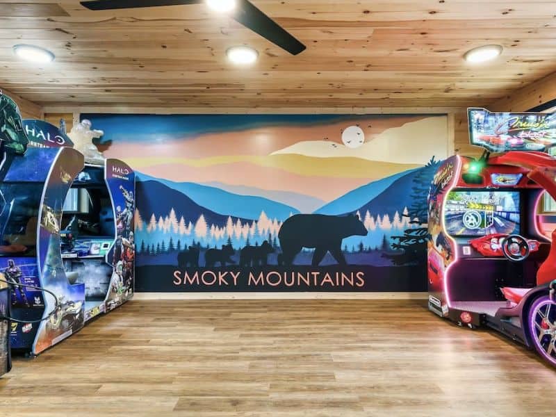 Game room with Smoky Mountains wall mural at a large cabin rental in Gatlinburg