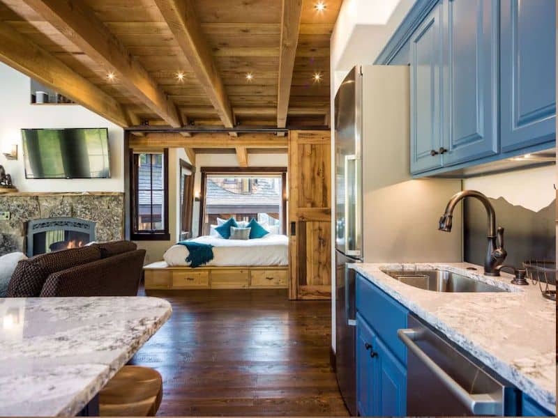A rental in Whitefish, MT featuring a kitchen with blue cabinets.