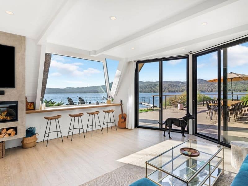 Bright and airy living space with a panoramic view of Big Bear Lake at Loro's Lookout, a luxury cabin in Big Bear, CA