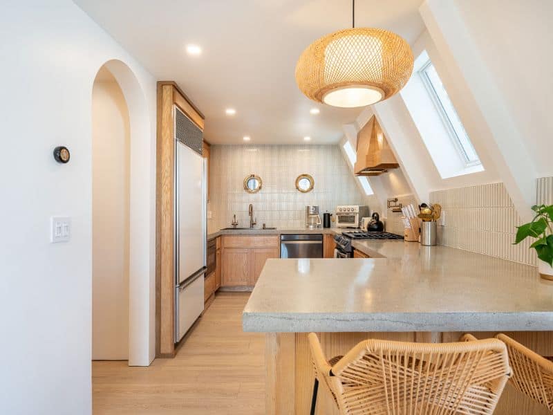 Modern kitchen with elegant fixtures and a breakfast bar in Loro's Lookout, a luxurious cabin rental in Big Bear right on the lake.