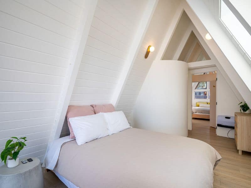 Minimalist bedroom with sleek design and natural light in a luxury cabin in Big Bear - Loro's Lookout.