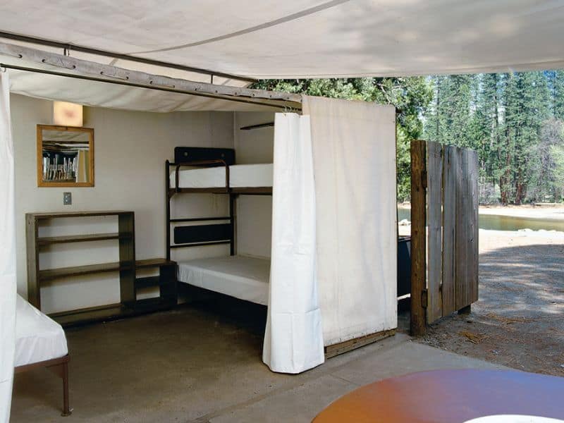 Basic Yosemite glamping setup at Housekeeping Camp with bunk beds and a rustic outdoor feel, offering a no-frills yet comfortable camping/glamping experience in Yosemite Valley.